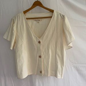 Cream top with tan buttons